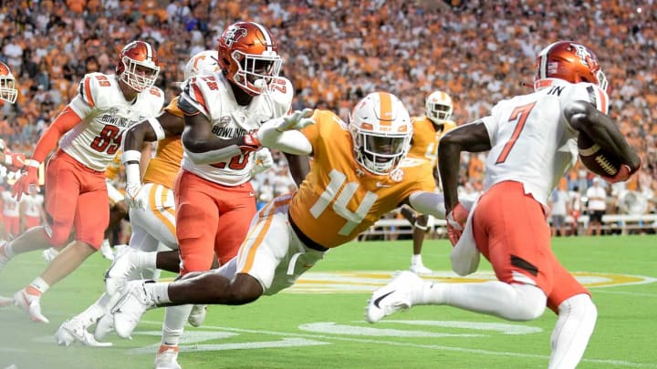 Tennessee defensive back Christian Charles (14) tackles Bowling Green cornerback Davon Ferguson (7) during a game at Neyland Stadium in Knoxville, Tenn. on Thursday, Sept. 2, 2021.Kns Tennessee Bowling Green Football