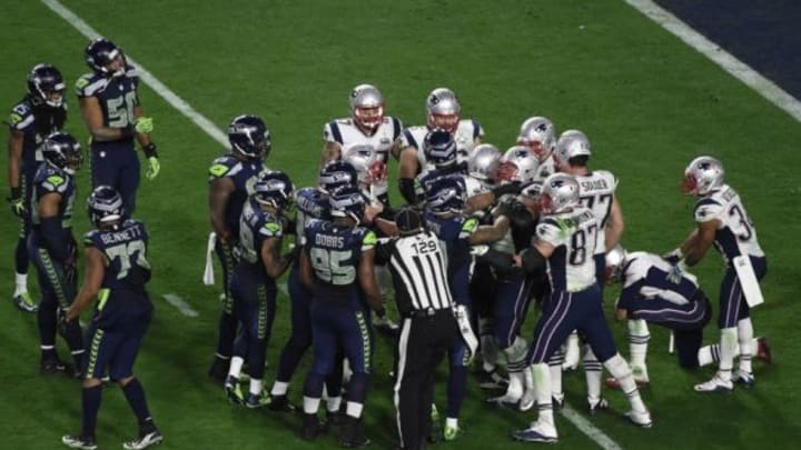 Feb 1, 2015; Glendale, AZ, USA; The New England Patriots and the Seattle Seahawks fight during the fourth quarter in Super Bowl XLIX at University of Phoenix Stadium. Mandatory Credit: Richard Mackson-USA TODAY Sports