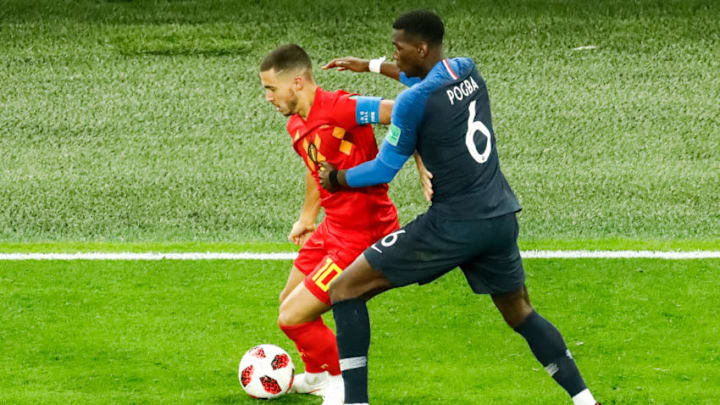 Paul Pogba (R) of France national team and Eden Hazard of Belgium national team vie for the ball during the 2018 FIFA World Cup Russia Semi Final match between France and Belgium on July 10, 2018 at Saint Petersburg Stadium in Saint Petersburg, Russia. (Photo by Mike Kireev/NurPhoto via Getty Images)