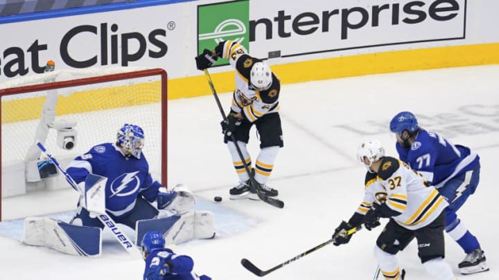 Aug 25, 2020; Toronto, Ontario, CAN; Boston Bruins left wing Brad Marchand (63) scores a goal past Tampa Bay Lightning goaltender Andrei Vasilevskiy (88) during the second period in game two of the second round of the 2020 Stanley Cup Playoffs at Scotiabank Arena. Mandatory Credit: John E. Sokolowski-USA TODAY Sports