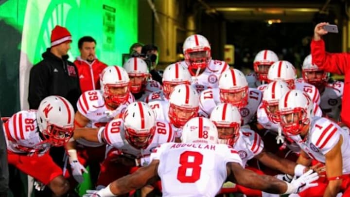 Oct 4, 2014; East Lansing, MI, USA; Nebraska Cornhuskers running back Ameer Abdullah (8) brings the offense on the field prior to a game against the Michigan State Spartans at Spartan Stadium. Mandatory Credit: Mike Carter-USA TODAY Sports