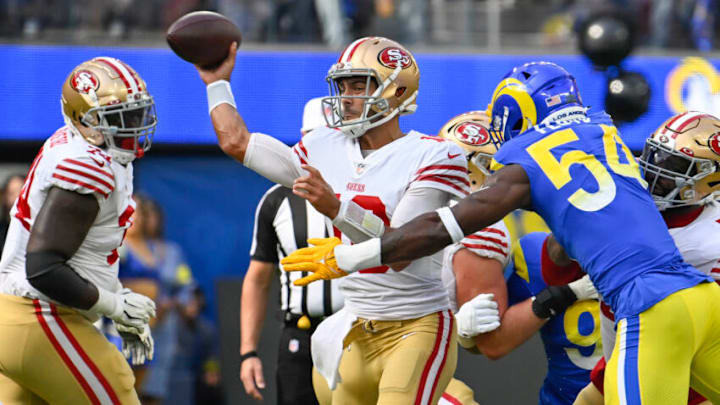 San Francisco 49ers quarterback Jimmy Garoppolo (10) against Los Angeles Rams linebacker Leonard Floyd (54) Mandatory Credit: Robert Hanashiro-USA TODAY Sports