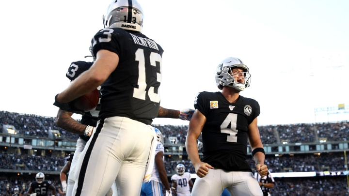 OAKLAND, CALIFORNIA – NOVEMBER 03: Hunter Renfrow #13 of the Oakland Raiders is congratulated by Derek Carr #4 and Darren Waller #83 after he caught the winning touchdown pass against the Detroit Lions at RingCentral Coliseum on November 03, 2019 in Oakland, California. (Photo by Ezra Shaw/Getty Images)