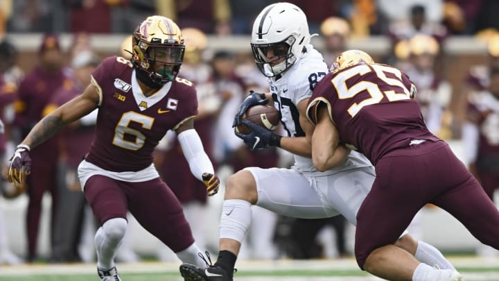 MINNEAPOLIS, MINNESOTA – NOVEMBER 09: Tight end Pat Freiermuth #87 of the Penn State Nittany Lions is tackled by linebacker Mariano Sori-Marin #55 of the Minnesota Golden Gophers during the second quarter at TCFBank Stadium on November 09, 2019 in Minneapolis, Minnesota. (Photo by Hannah Foslien/Getty Images)