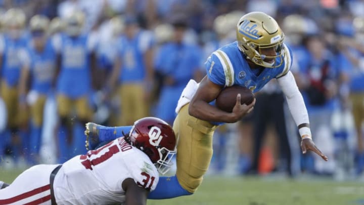 LOS ANGELES, CALIFORNIA - SEPTEMBER 14: Jalen Redmond #31 of the Oklahoma Sooners sacks Dorian Thompson-Robinson #1 of the UCLA Bruins during the first half of a game on at the Rose Bowl on September 14, 2019 in Los Angeles, California. (Photo by Sean M. Haffey/Getty Images)