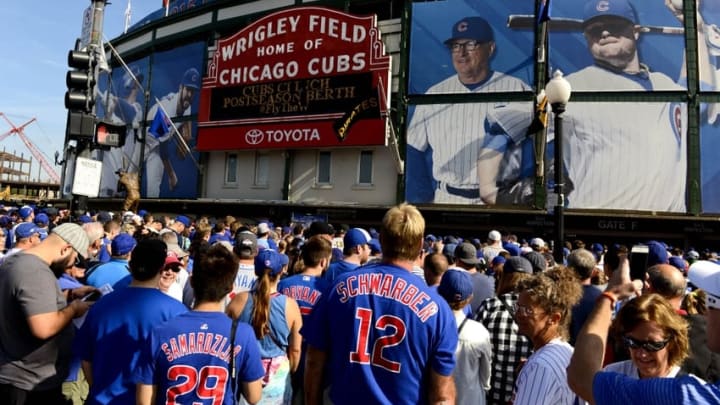 Sep 26, 2015; Chicago, IL, USA; Fans wait to enter Wrigley Field before the game between the Chicago Cubs and the Pittsburgh Pirates. The Cubs clinched a playoff spot on Friday. Mandatory Credit: Matt Marton-USA TODAY Sports