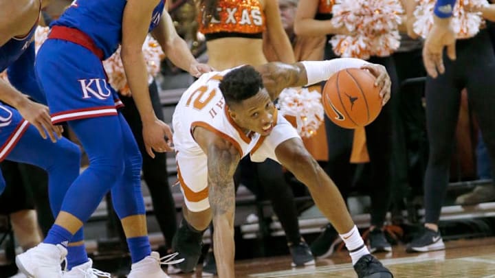 AUSTIN, TEXAS - JANUARY 29: Kerwin Roach II #12 of the Texas Longhorns moves with the ball while being fouled in the final minutes against the Kansas Jayhawks at The Frank Erwin Center on January 29, 2019 in Austin, Texas. (Photo by Chris Covatta/Getty Images)