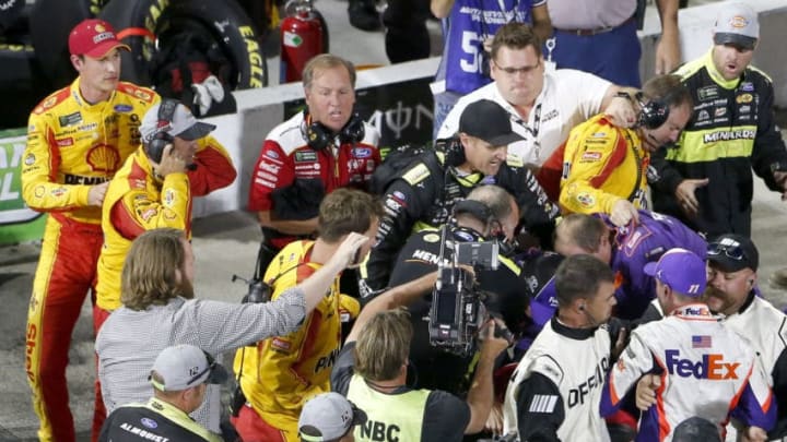 MARTINSVILLE, VIRGINIA - OCTOBER 27: Denny Hamlin, driver of the #11 FedEx Freight Toyota, Joey Logano, driver of the #22 Shell Pennzoil Ford, and their crews have an altercation on pit lane following the Monster Energy NASCAR Cup Series First Data 500 at Martinsville Speedway on October 27, 2019 in Martinsville, Virginia. (Photo by Brian Lawdermilk/Getty Images)