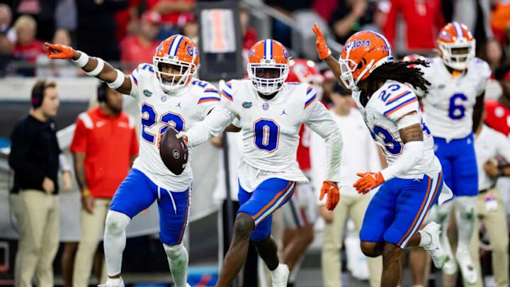 Florida Gators safety Trey Dean III (0) celebrates with Florida Gators safety Rashad Torrence II (22) and Florida Gators cornerback Jaydon Hill (23) after recovering a fumble during the second half against the Georgia Bulldogs at TIAA Bank Field in Jacksonville, FL on Saturday, October 29, 2022. [Matt Pendleton/Gainesville Sun]Ncaa Football Florida Gators Vs Georgia Bulldogs