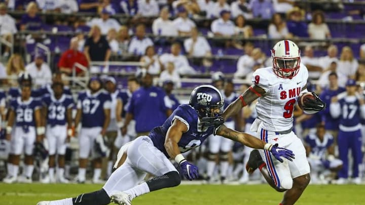 Sep 19, 2015; Fort Worth, TX, USA; Southern Methodist Mustangs defensive back Horace Richardson (9) intercepts a ball and is chased by TCU Horned Frogs wide receiver Josh Doctson (9) during the game at Amon G. Carter Stadium. Mandatory Credit: Kevin Jairaj-USA TODAY Sports