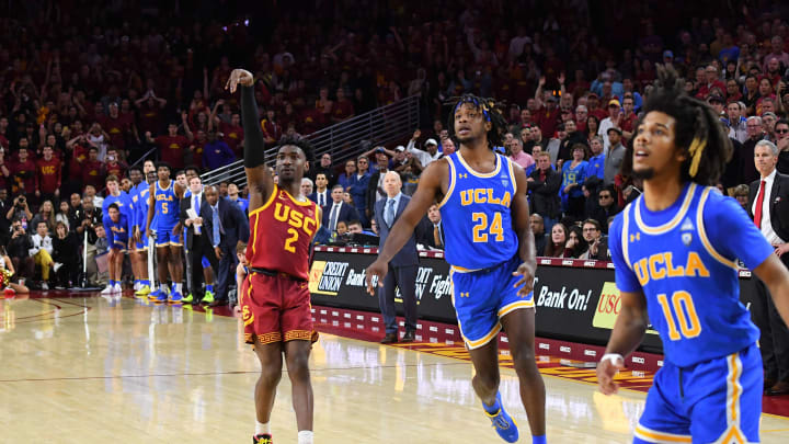 LOS ANGELES, CA – MARCH 07: Jalen Hill #24 and Tyger Campbell #10 of the UCLA Bruins watch as a 3-point shot by Jonah Mathews #2 of the USC Trojans (Photo by Jayne Kamin-Oncea/Getty Images)