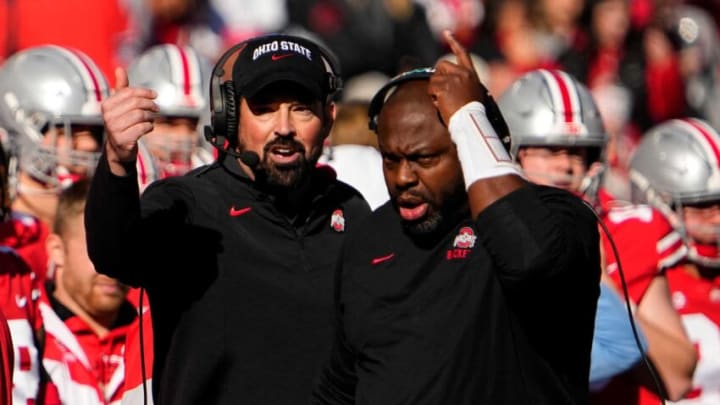 Nov 26, 2022; Columbus, Ohio, USA; Ohio State Buckeyes head coach Ryan Day and running backs coach Tony Alford motion from the sideline during the first half of the NCAA football game against the Michigan Wolverines at Ohio Stadium. Mandatory Credit: Adam Cairns-The Columbus DispatchNcaa Football Michigan Wolverines At Ohio State Buckeyes