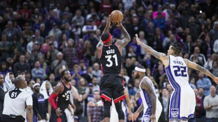 Nov 20, 2016; Sacramento, CA, USA; Toronto Raptors forward Terrence Ross (31) shoots the basketball seemingly tying the basketball game against Sacramento Kings forward Matt Barnes (22), but the shot is ruled after time had expired during the fourth quarter at Golden 1 Center. The Kings won 102-99. Mandatory Credit: Neville E. Guard-USA TODAY Sports