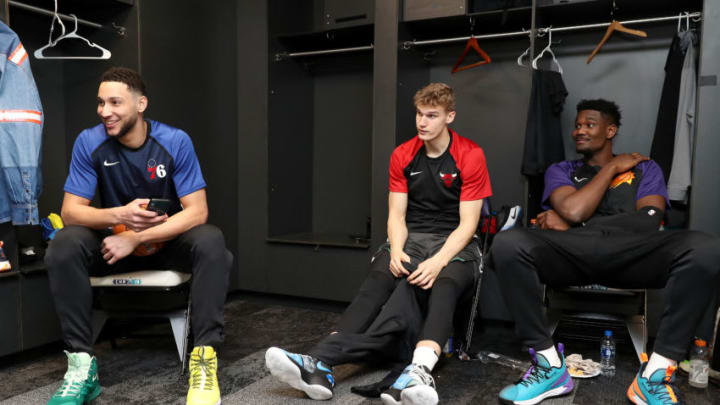 CHARLOTTE, NC - FEBRUARY 15: Ben Simmons #25, Lauri Markkanen #24, and Deandre Ayton #22 of the World Team talk before the 2019 Mtn Dew ICE Rising Stars Game on February 15, 2019 at the Spectrum Center in Charlotte, North Carolina.
