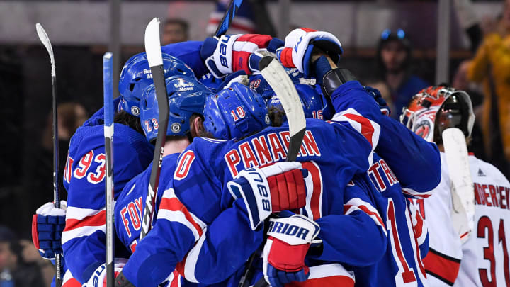 Apr 12, 2022; New York, New York, USA; New York Rangers players celebrate the 50th goal of the season by left wing Chris Kreider (20) against the Carolina Hurricanes during the third period at Madison Square Garden. Mandatory Credit: Dennis Schneidler-USA TODAY Sports