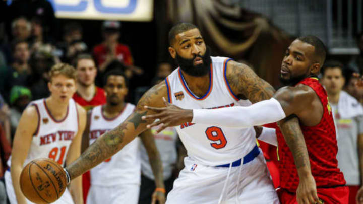 Jan 29, 2017; Atlanta, GA, USA; New York Knicks center Kyle O'Quinn (9) tries to keep the ball away from Atlanta Hawks forward Paul Millsap (4) during the second overtime at Philips Arena. Mandatory Credit: Butch Dill-USA TODAY Sports