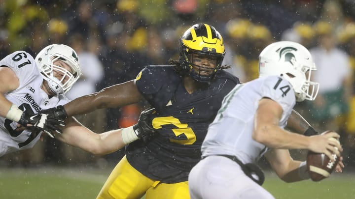 ANN ARBOR, MI – OCTOBER 07: Rashan Gary #3 of the Michigan Wolverines makes the stop on Brian Lewerke #14 of the Michigan State Spartans during the fourth quarter of the game at Michigan Stadium on October 7, 2017 in Ann Arbor, Michigan. Michigan State defeated Michigan 14-10. (Photo by Leon Halip/Getty Images)