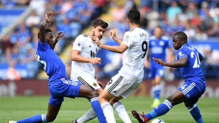 LEICESTER, ENGLAND – AUGUST 18: Ruben Neves and Raul Jimenez of Wolverhampton Wanderers battle for the ball with Onyinye Wilfred Ndidi and Nampalys Mendy of Leicester City during the Premier League match between Leicester City and Wolverhampton Wanderers at The King Power Stadium on August 18, 2018 in Leicester, United Kingdom. (Photo by Michael Regan/Getty Images)