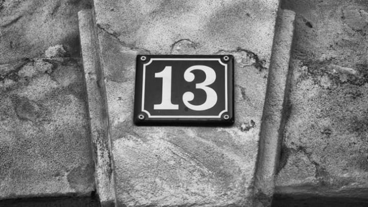 The number thirteen on a street placard