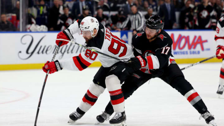 Mar 24, 2023; Buffalo, New York, USA; New Jersey Devils left wing Tomas Tatar (90) takes a shot on goal as Buffalo Sabres center Tyson Jost (17) defends during the first period at KeyBank Center. Mandatory Credit: Timothy T. Ludwig-USA TODAY Sports