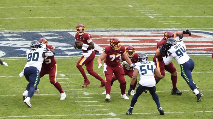 Dec 20, 2020; Landover, Maryland, USA; Washington Football Team quarterback Dwayne Haskins Jr. (7) drops back to pass against the Seattle Seahawks during the first half at FedExField. Mandatory Credit: Brad Mills-USA TODAY Sports
