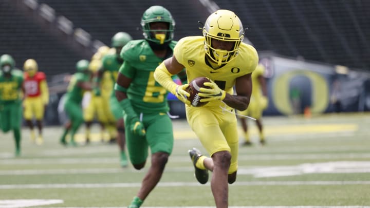 May 1, 2021; Eugene, Oregon, USA; Oregon Ducks wide receiver Troy Franklin (11) makes a catch in front of corner back Jaylin Davies (6) during Oregon Spring Game at Autzen Stadium. Mandatory Credit: Soobum Im-USA TODAY Sports