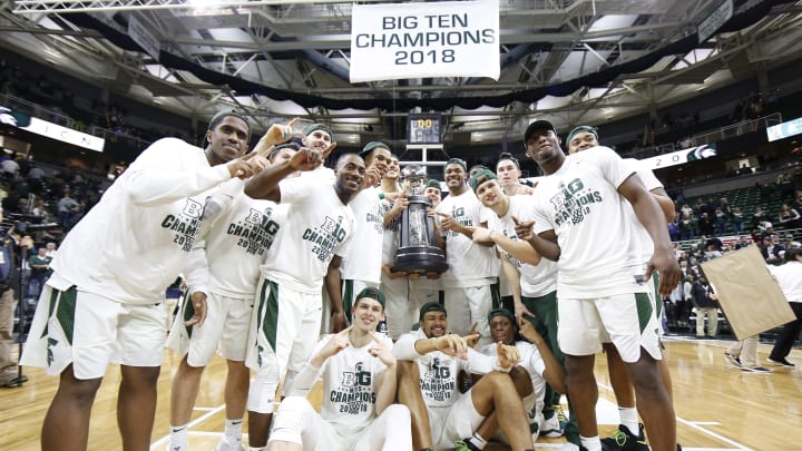 EAST LANSING, MI – FEBRUARY 20: Michigan State Spartans celebrate with the Big Ten trophy after the Spartan defeated the Illinois Fighting Illini at Breslin Center on February 20, 2018 in East Lansing, Michigan. (Photo by Rey Del Rio/Getty Images)