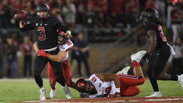 PALO ALTO, CA - OCTOBER 06: K.J. Costello #3 of the Stanford Cardinal gets sacked by Chase Hansen #22 of the Utah Utes during the first quarter of their NCAA football game at Stanford Stadium on October 6, 2018 in Palo Alto, California. (Photo by Thearon W. Henderson/Getty Images) PALO ALTO, CA - OCTOBER 06: K.J. Costello #3 of the Stanford Cardinal gets sacked by Chase Hansen #22 of the Utah Utes during the first quarter of their NCAA football game at Stanford Stadium on October 6, 2018 in Palo Alto, California. (Photo by Thearon W. Henderson/Getty Images)
