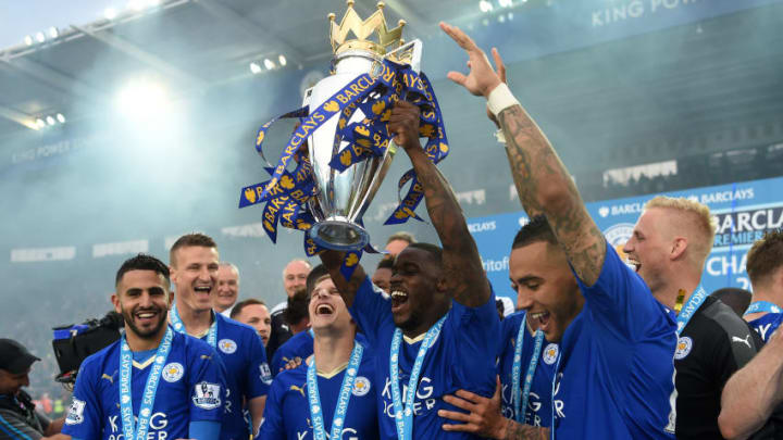 LEICESTER, ENGLAND - MAY 07: Jeff Schlupp of Leicester City lifts the Premier League Trophy as players and staffs celebrate the season champion after the Barclays Premier League match between Leicester City and Everton at The King Power Stadium on May 7, 2016 in Leicester, United Kingdom. (Photo by Michael Regan/Getty Images)