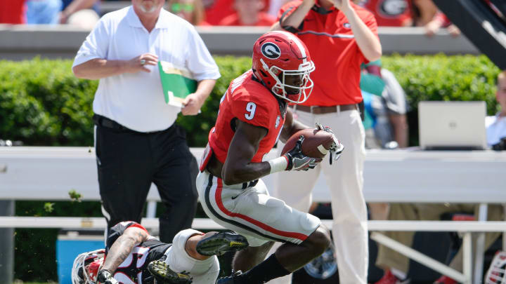 Apr 22, 2017; Athens, GA, USA; Georgia Bulldogs red team wide receiver Jeremiah Holloman (9) catches a pass against black team defensive back Tim Hill (29) during the first half during the Georgia Spring Game at Sanford Stadium. Mandatory Credit: Dale Zanine-USA TODAY Sports