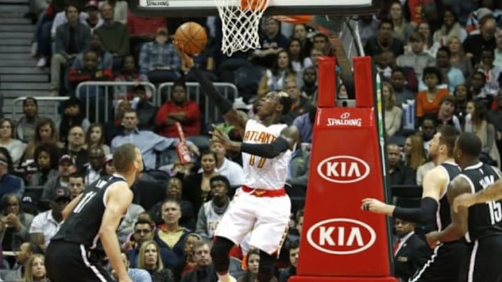 Jan 16, 2016; Atlanta, GA, USA; Atlanta Hawks guard Dennis Schroder (17) shoots a reverse layup in the second quarter against the Brooklyn Nets at Philips Arena. Mandatory Credit: Jason Getz-USA TODAY Sports