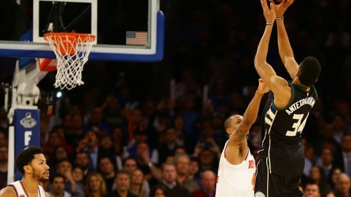 Jan 4, 2017; New York, NY, USA; Milwaukee Bucks forward Giannis Antetokounmpo (34) puts up the game winning basket at the buzzer against New York Knicks during the first half at Madison Square Garden. The Bucks won 105-104. Mandatory Credit: Andy Marlin-USA TODAY Sports