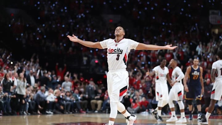 Oct 25, 2016; Portland, OR, USA; Portland Trail Blazers guard C.J. McCollum (3) celebrates after a basket by Trail Blazers guard Damian Lillard (0) late in the fourth quarter against the Utah Jazz at Moda Center at the Rose Quarter. Portland won 113-104. Mandatory Credit: Jaime Valdez-USA TODAY Sports