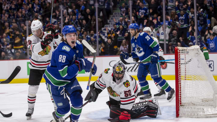 Adam Gaudette #88 of the Vancouver Canucks scores (Photo by Ben Nelms/Getty Images)