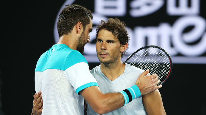 MELBOURNE, AUSTRALIA – JANUARY 23: Marin Cilic of Croatia and Rafael Nadal of Spain embrace after Nadal retired with an injury in their quarter-final match on day nine of the 2018 Australian Open at Melbourne Park on January 23, 2018 in Melbourne, Australia. (Photo by Mark Kolbe/Getty Images)