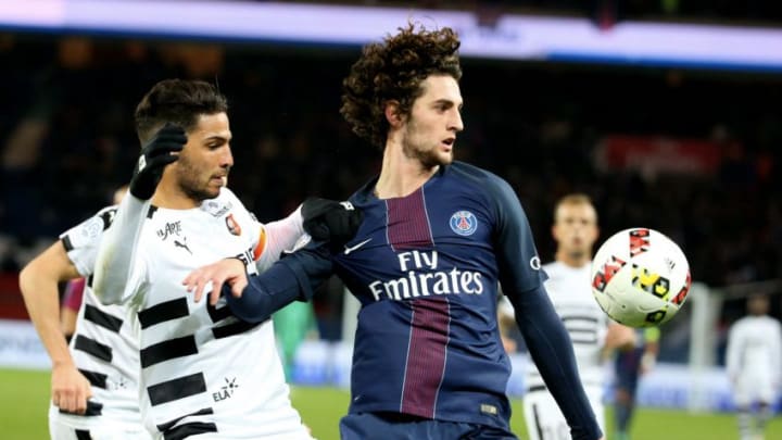 PARIS, FRANCE - NOVEMBER 06: Adrien Rabiot of Paris Saint-Germain in action with Selmane Bensebaini of Stade Rennes during the French Ligue 1 match between Paris Saint-Germain and Stade Rennes FC at Parc des Princes on november 06, 2016 in Paris, France. (Photo by Xavier Laine/Getty Images)