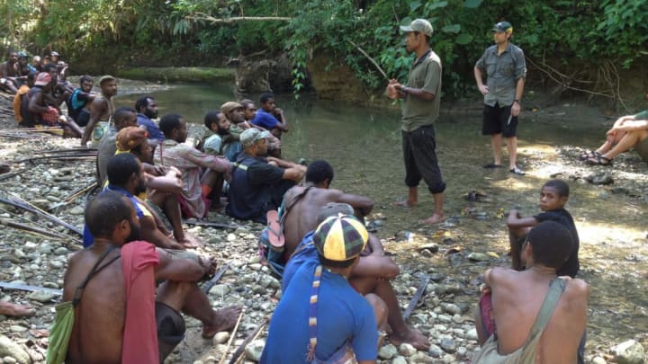 Scientists speak to residents in Aitape.