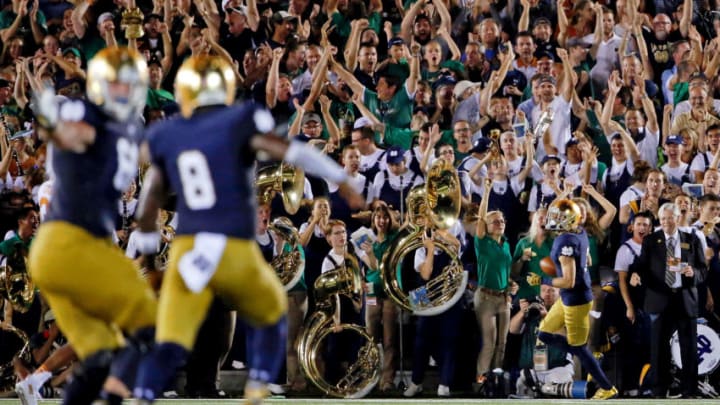 SOUTH BEND, IN – SEPTEMBER 05: Malik Zaire #8 of the Notre Dame Fighting Irish and Mike McGlinchey #68 (L) celebrate a touchdown pass to William Fuller #7 (R) against the Texas Longhorns during the third quarter at Notre Dame Stadium on September 5, 2015 in South Bend, Indiana. The Notre Dame Fighting Irish won 38-3. (Photo by Jon Durr/Getty Images)
