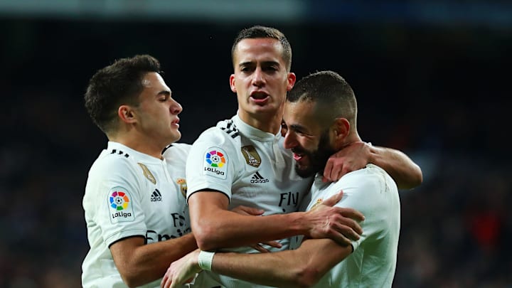 MADRID, SPAIN – DECEMBER 01: Lucas Vazquez of Real Madrid (C) celebrates after scoring his team’s second goal with Karim Benzema (R) and Sergio Reguilon (L) during the La Liga match between Real Madrid CF and Valencia CF at Estadio Santiago Bernabeu on December 01, 2018 in Madrid, Spain. (Photo by Gonzalo Arroyo Moreno/Getty Images)