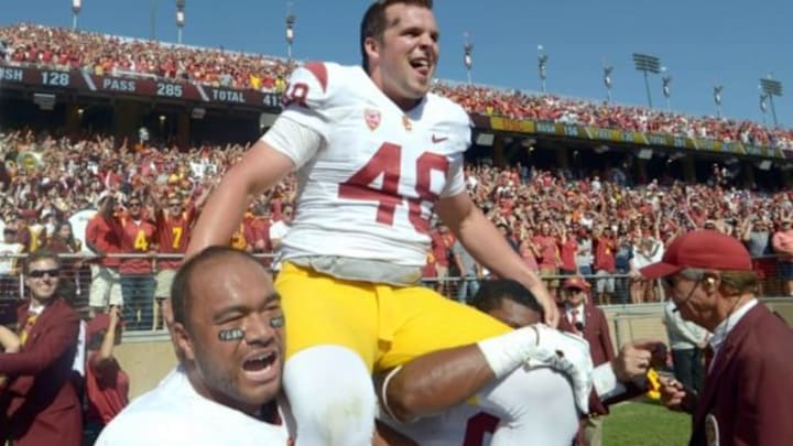 Sep 6, 2014; Stanford, CA, USA; Southern California Trojans kicker Andre Heidari (48) is hoisted by teammates Soma Vainuku (31) and receiver JuJu Smith after kicking a 53-yard field goal for the winning points against the Stanford Cardinal at Stanford Stadium. USC defeated Stanford 13-10. Mandatory Credit: Kirby Lee-USA TODAY Sports Sep 6, 2014; Stanford, CA, USA; Southern California Trojans kicker Andre Heidari (48) is hoisted by teammates Soma Vainuku (31) and receiver JuJu Smith after kicking a 53-yard field goal for the winning points against the Stanford Cardinal at Stanford Stadium. USC defeated Stanford 13-10. Mandatory Credit: Kirby Lee-USA TODAY Sports