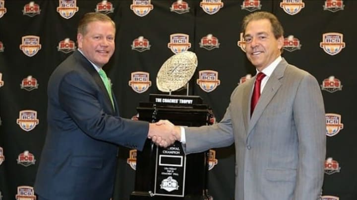 Jan 6, 2013; Fort Lauderdale FL, USA; Notre Dame head coach Brian Kelly (left) shakes hands with Alabama Crimson Tide head coach Nick Saban during a press conference for the 2013 BCS National Championship game at Harbor Beach Marriott Resort