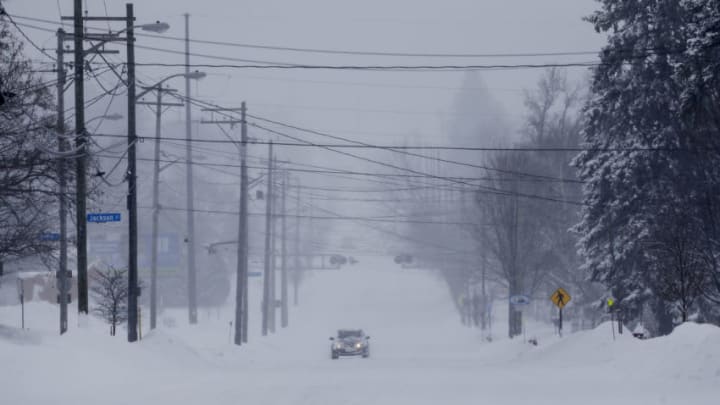 February 12, 2019; Manitowoc, WI, USA; A vehicle heads south on 10th Street as snow blankets the area Tuesday, February 12, 2019, in Manitowoc, Wis. The latest winter storm to hit Wisconsin is expected to bring 6-12 inches by the end of Tuesday. Mandatory Credit: Joshua Clark/Herald Times Reporter via USA TODAY NETWORK