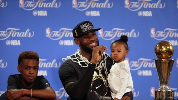 June 19, 2016; Oakland, CA, USA; Cleveland Cavaliers forward LeBron James (23) speaks to media with his children Lebron James Jr. and Zhuri James present following the 93-89 victory against the Golden State Warriors in game seven of the NBA Finals at Oracle Arena. Mandatory Credit: Kelley L Cox-USA TODAY Sports