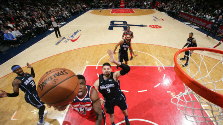 WASHINGTON, DC -  MARCH 13: Thomas Bryant #13 of the Washington Wizards puts up the layup against the Orlando Magic on March 13, 2019 at Capital One Arena in Washington, DC. NOTE TO USER: User expressly acknowledges and agrees that, by downloading and or using this Photograph, user is consenting to the terms and conditions of the Getty Images License Agreement. Mandatory Copyright Notice: Copyright 2019 NBAE (Photo by Stephen Gosling/NBAE via Getty Images)