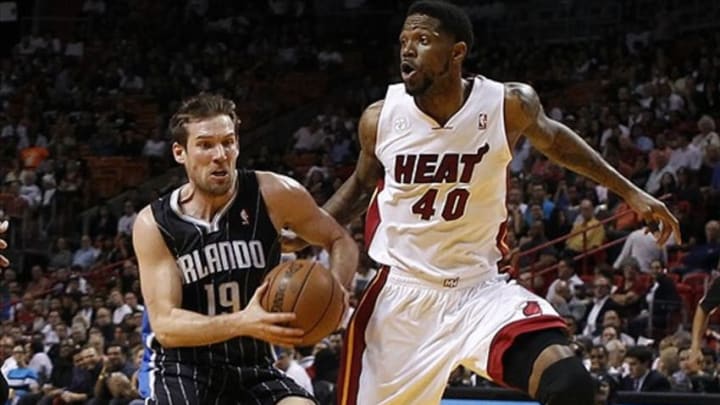 Apr 17, 2013; Miami, FL, USA; Orlando Magic point guard Beno Udrih (19) drives to the basket past Miami Heat power forward Udonis Haslem (40) in the first quarter at the American Airlines Arena. Mandatory Credit: Robert Mayer-USA TODAY Sports