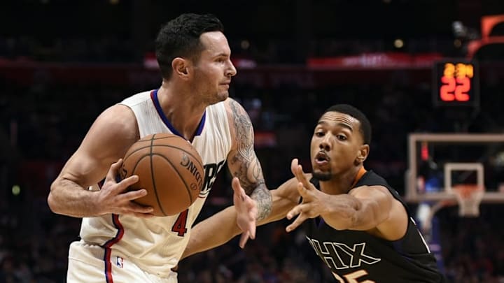 Feb 22, 2016; Los Angeles, CA, USA; Los Angeles Clippers guard J.J. Redick (4) moves the ball defended by Phoenix Suns guard Phil Pressey (right) during the third quarter at Staples Center. The Los Angeles Clippers won 124-84. Mandatory Credit: Kelvin Kuo-USA TODAY Sports