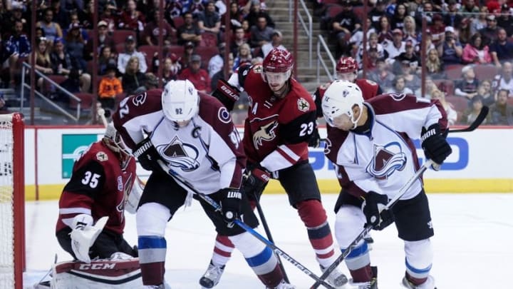 Oct 29, 2016; Glendale, AZ, USA; Colorado Avalanche left wing Gabriel Landeskog (92) and right wing Jarome Iginla (12) look for the puck as Arizona Coyotes goalie Louis Domingue (35) and defenseman Oliver Ekman-Larsson (23) defend during the third period and at Gila River Arena. Mandatory Credit: Matt Kartozian-USA TODAY Sports