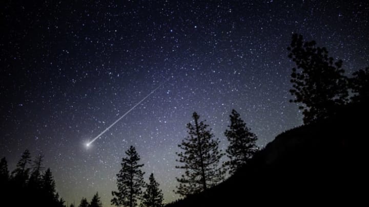 A night sky with a shooting star.