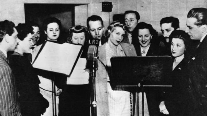Eva Duarte (center, in 1944) made her name as a radio actress before marrying Juan Perón and becoming the First Lady of Argentina.