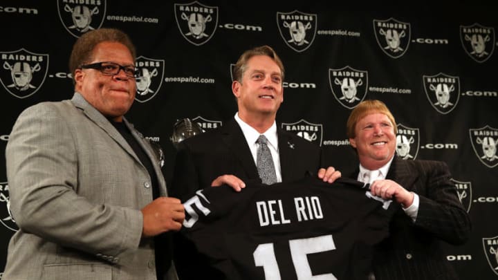 ALAMEDA, CA - JANUARY 16: Oakland Raiders new head coach Jack Del Rio (C) holds a jersey as he poses for a photograph with Raiders general manager Reggie McKenzie (L) and Raiders owner Mark Davis (R) during a news conference on January 16, 2015 in Alameda, California. The Oakland Raiders announced the hiring of Jack Del Rio as their new head coach. (Photo by Justin Sullivan/Getty Images)